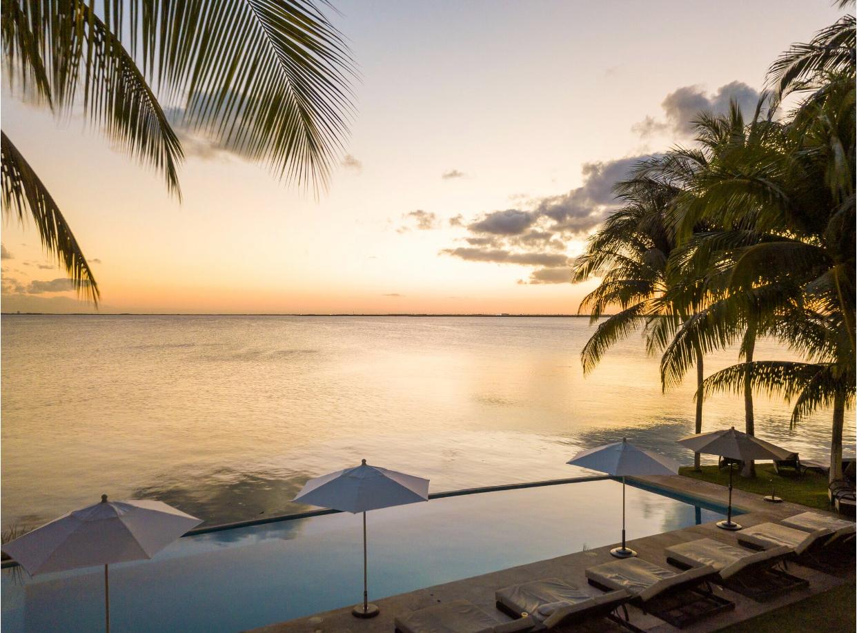 Casa Tortugas Boutique Hotel Cancun overlooking the lagoon at sunset